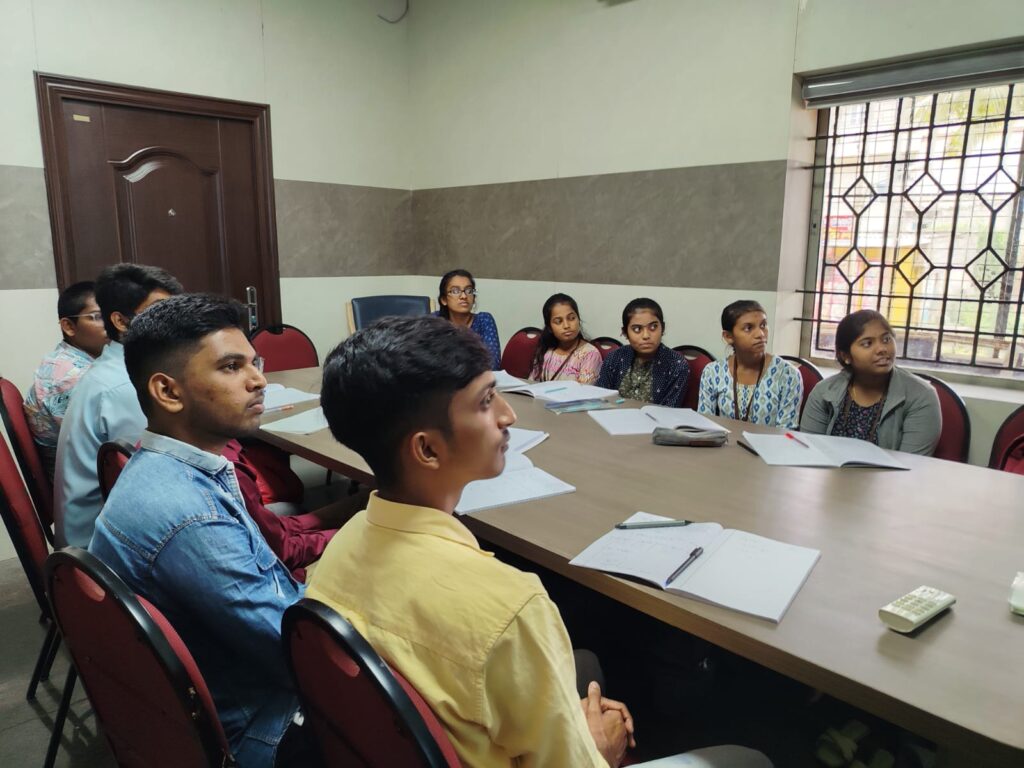 Students participating in a small-group classroom discussion