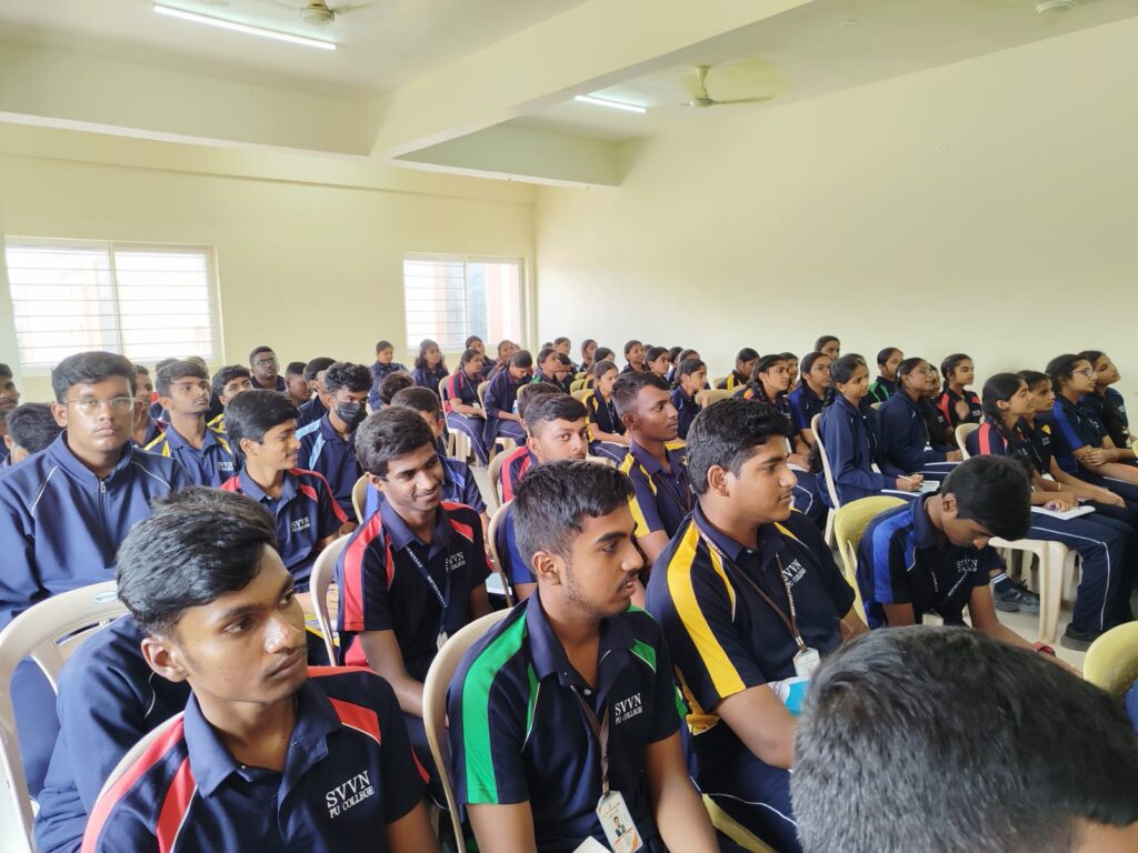 A large group of students attending a classroom programme